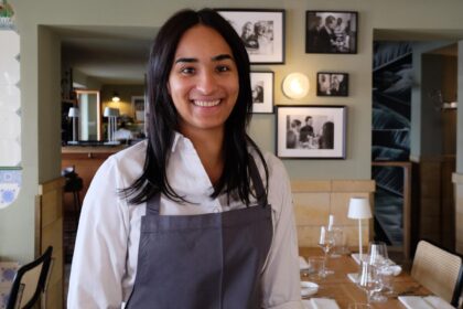 Waitress in a restaurant setting.