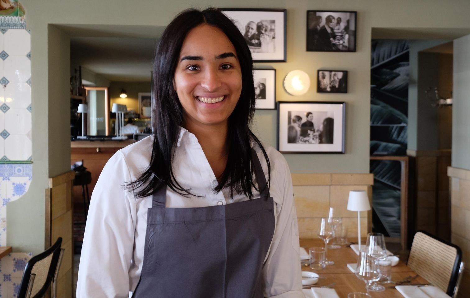 Waitress in a restaurant setting.