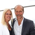 Couple posing on a rooftop terrace.