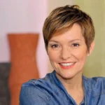 Person with short hair, casual attire.