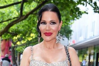 Elegant woman in sparkling dress.