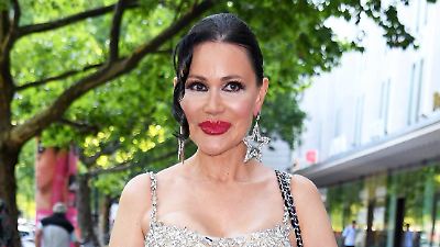 Elegant woman in sparkling dress.