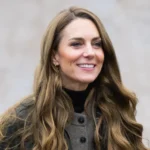 Long hair, casual outfit, serene expression.