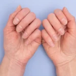 Two hands with natural nails.