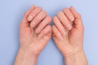 Two hands with natural nails.